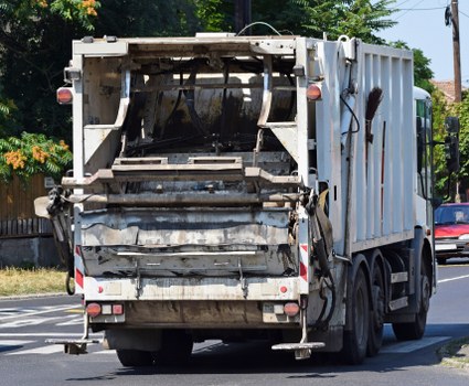 Electric low-emission collection van on a Sydenham street